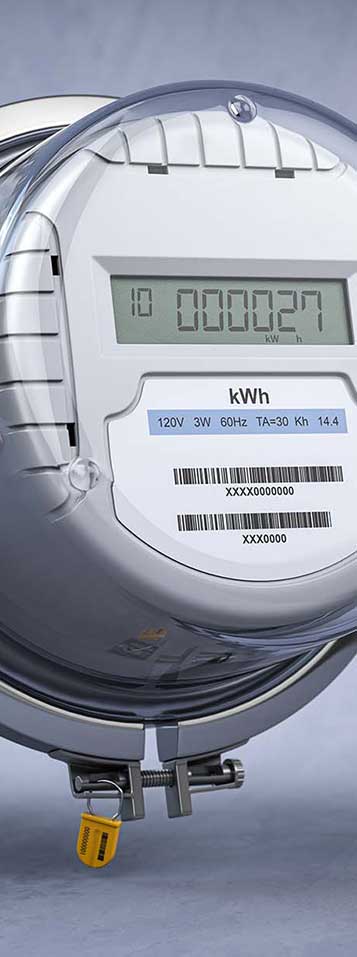 Digital electric meter with lcd screen on grey dirty background. Electricity consumption concept.